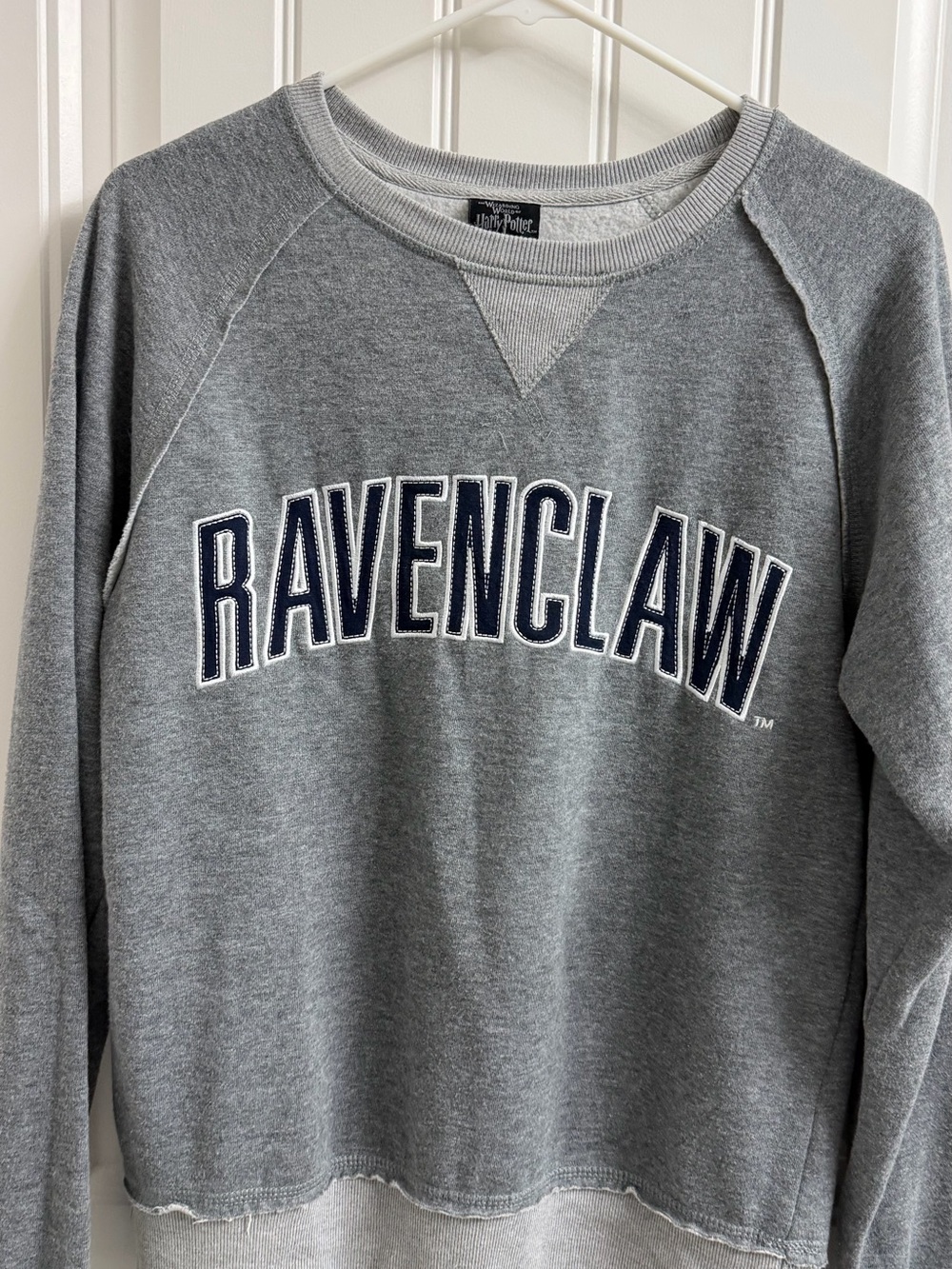 Warner Bros. Black and Gray Apparel Tag Close-Up